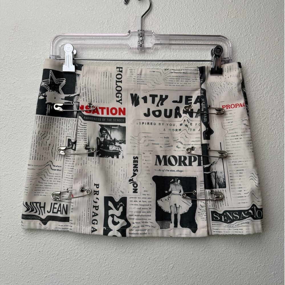 With Jéan Ivory Newspaper Print Safety Pin Mini Skirt